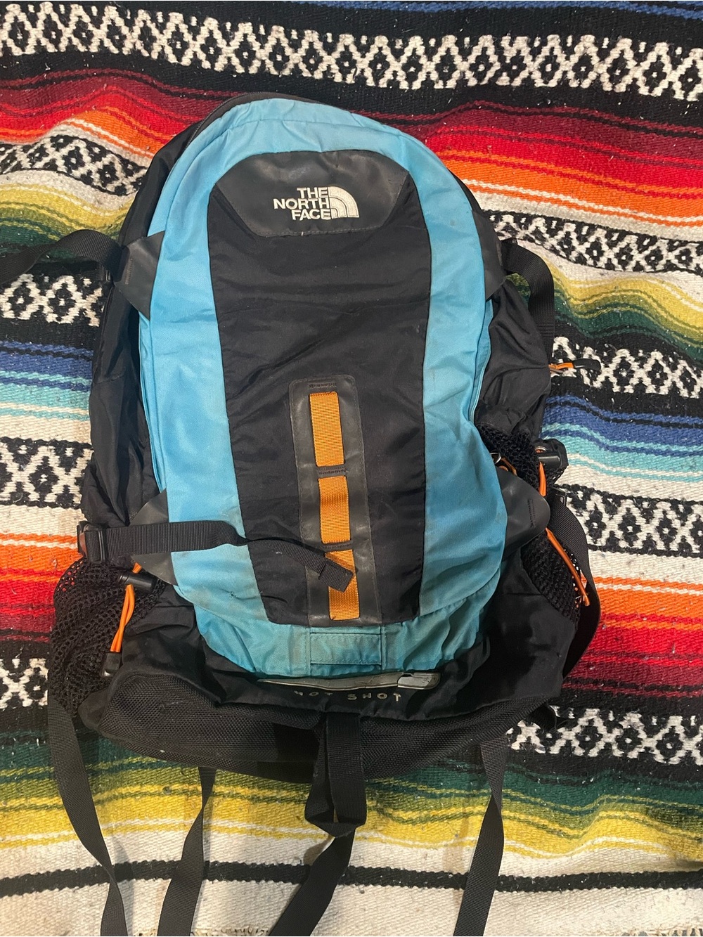 The North Face Men’s “Hot Shot” Blue and Black Backpack with Orange Accents